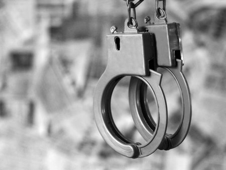 Handcuffs on a gray background, so close