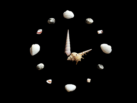 Handmade Clock Shells isolated on black background, objectの写真素材