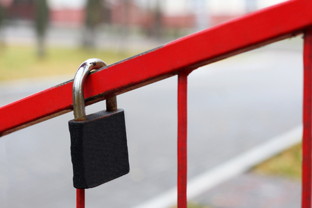Metal wedding lock on red fence, outdoorの写真素材