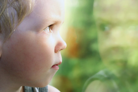 One sad little boy, portrait so close. Concept of sorrow. People.