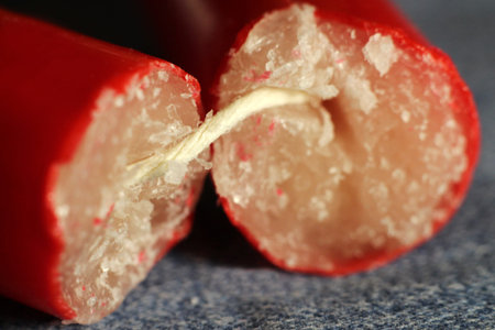 Red broken paraffin candle so close, macro object