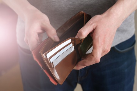 Leather wallet with credit cards in men's hands so closeの写真素材