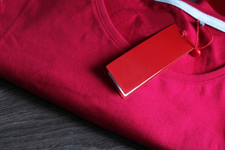 blank price tag hang over t-shirt, pink coloredの写真素材
