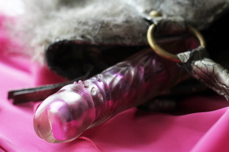 Female pink vibrator. Sex toy for adults. So close.