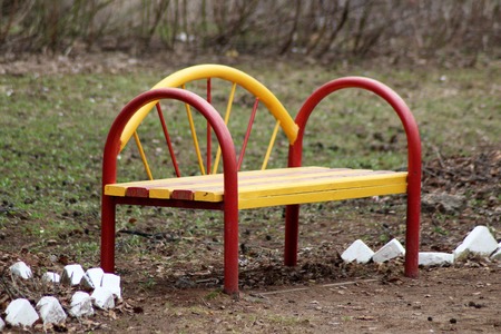 Bright yellow-red Park bench, outdoor objectの写真素材