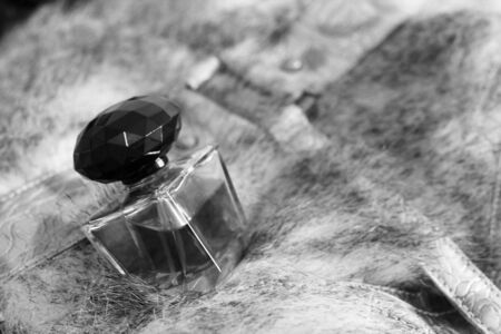 bottle of brawn perfume on a fur so closeの写真素材