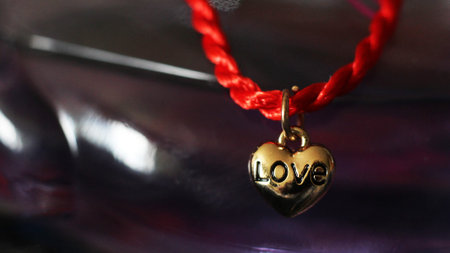 Red thread with gold heart pendant and women's perfume, gift