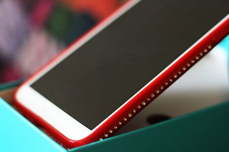Red smartphone with rhinestones so closeの写真素材