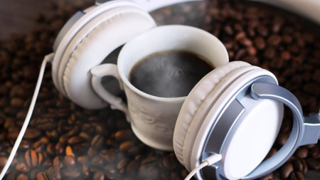 Rosted coffee beans and headphone on a table