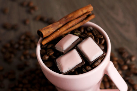 Pieces of dark chokolate and coffee beans