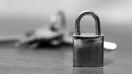 Macro of a locked padlock with the keysの写真素材