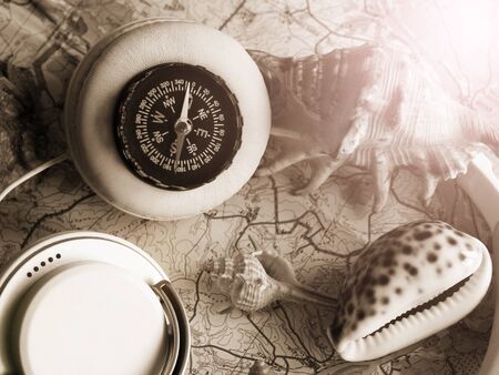 Compass, seashells and a map. A set of traveler's items.の写真素材