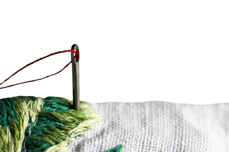 needle and thread and embroidery so close