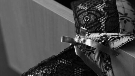 Beautiful fishnet bra and open underwear drawer so closeの写真素材