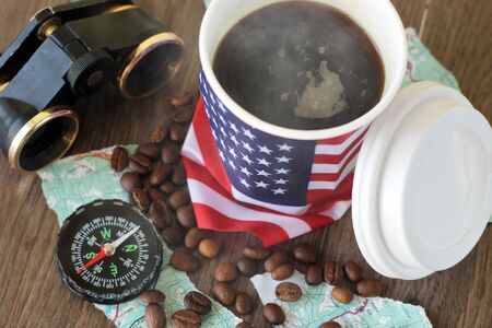 hot drink with USA flag, compass and map, travel objectの写真素材