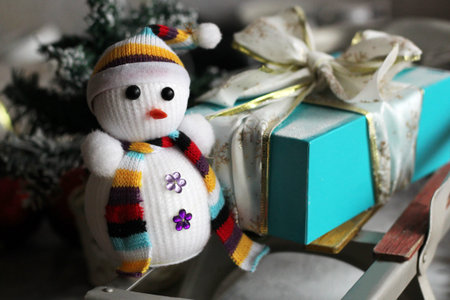 Christmas snowman toy close up with scarf, a gift