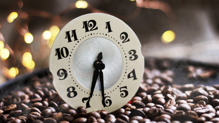 The dial of the watch and coffee beans so closeの写真素材