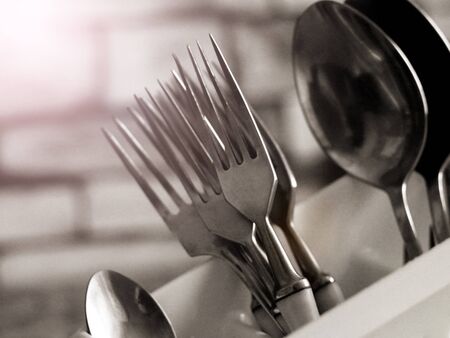 Set of forks and spoons on a stand so closeの写真素材