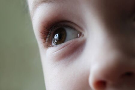 The child's eye is very close, peopleの写真素材