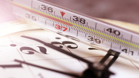 Medical thermometer and watch so close