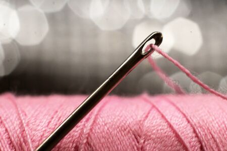 A macro image of a needle s eye threaded, objectの写真素材