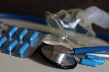 Stethoscope and blue capsules, health care