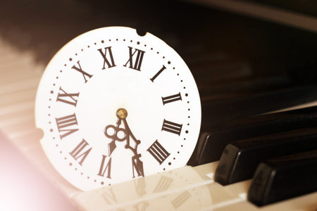 A clock with Roman numerals and a piano, retro