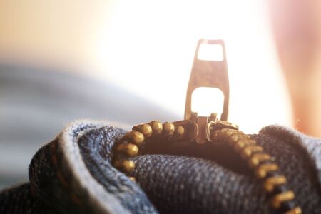 Detail of zipper on blue jeans. Macro with extremely shallow depth of fieldの写真素材