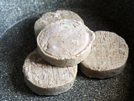 Cutlets, semi-finished products in a frying pan so closeの写真素材