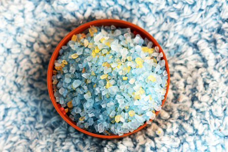 Sea blue bath salt in a bowl so closeの写真素材