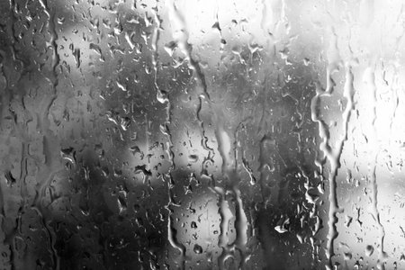 Water drops background, a glass of window