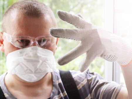 Portrait of a Man in a stretcher and safety glassesの写真素材