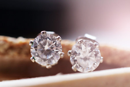 Silver diamond earrings so close, macro