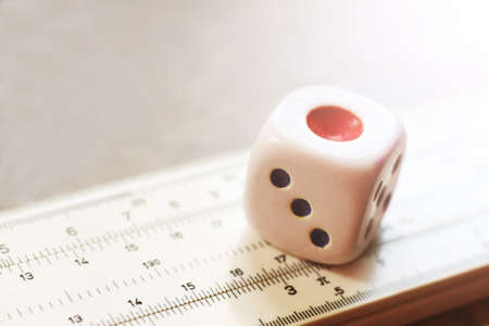 One dice and measuring instrument so closeの写真素材