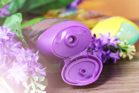 Shower gel and purple flowers so close