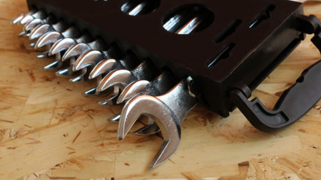 Set of new spanners over stainless steel background