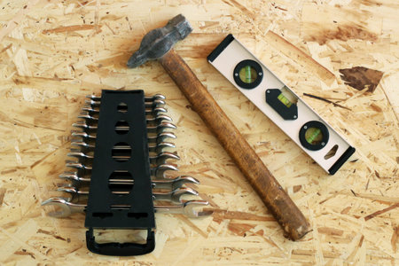 Building tool on a wooden background