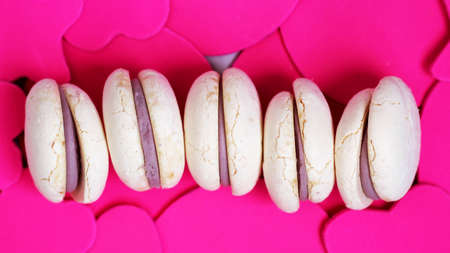 White macaroons with purple berry filling so closeの写真素材