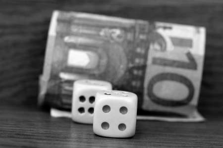 One bill of one hundred of euros and the dice so closeの写真素材