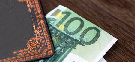 Hundred Euro and business book so closeの写真素材