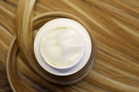 Mousse Foam Cleansing Foam On a blondy hair so closeの写真素材