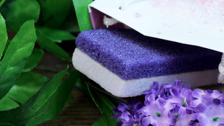 Purple beautiful pumice and flowers, self-care, tonedの写真素材