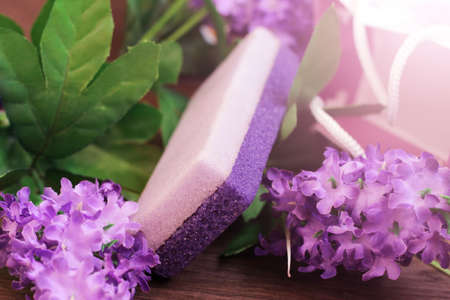 Purple beautiful pumice and flowers, self-care, tonedの写真素材