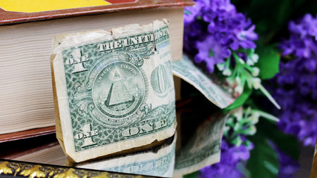 One dollar bill and flowers so close
