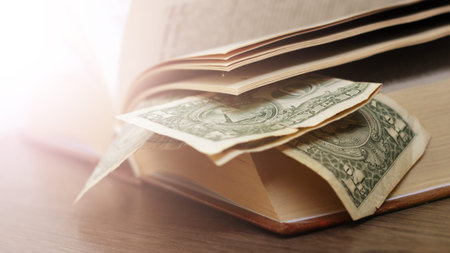 Old books with one dollar. Concept for buyng or selling books.