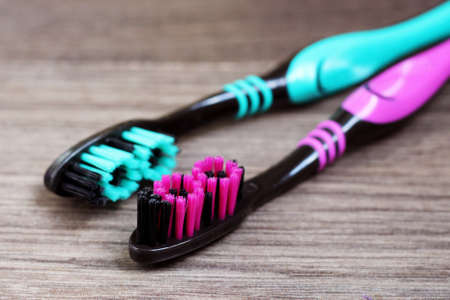 Two toothbrushes on a wooden background. Health.の写真素材