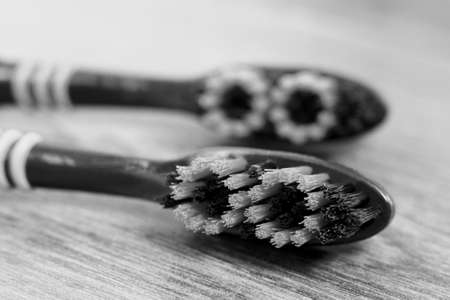 Two toothbrushes on a wooden background. Health.の写真素材