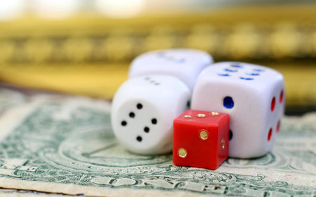 US dollars and playing dice so close