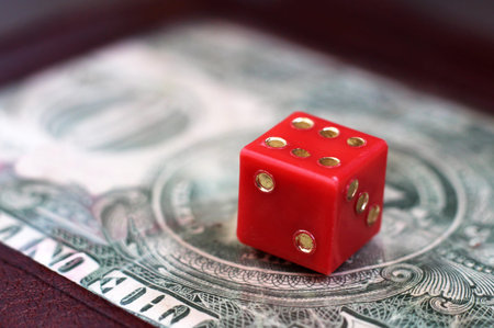 US dollars and playing dice so close