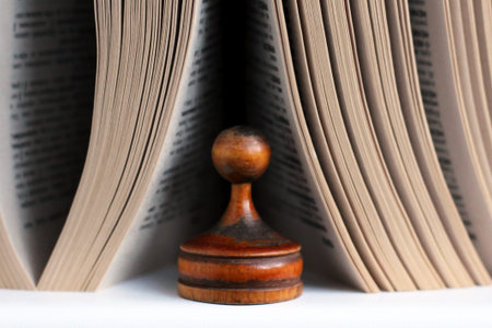 Chess with book on wooden background, retroの写真素材